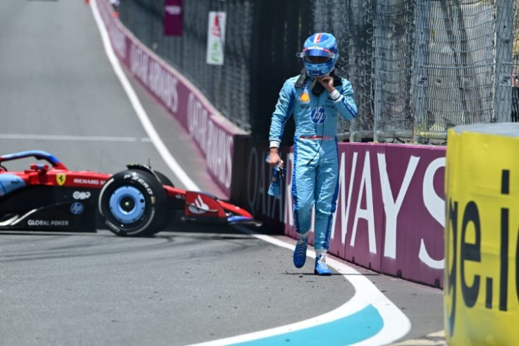 Ferrari's Monegasque driver Charles Leclerc walks off the track after spinning out during the practice session for the 2024 Miami Formula One Grand Prix on Friday.. ©AFP