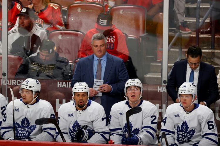 Toronto Maple Leafs head coach Sheldon Keefe, center, was fired by the NHL club after the team was ousted by Boston in the first round of the Stanley Cup playoffs . ©AFP