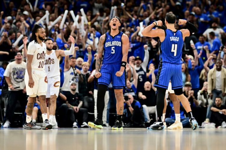 Paolo Banchero of the Orlando Magic celebrates with Jalen Suggs after a basket in the fourth quarter of the Magic's victory over the Cleveland Cavaliers in game six of their NBA Eastern Conference first round playoff series. ©AFP