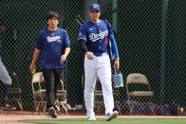 Los Angeles Dodgers star Shohei Ohtani (right) and former interpreter Ippei Mizuhara, who is to plead guilty to stealing nearly $17 million from the baseball ace. ©AFP