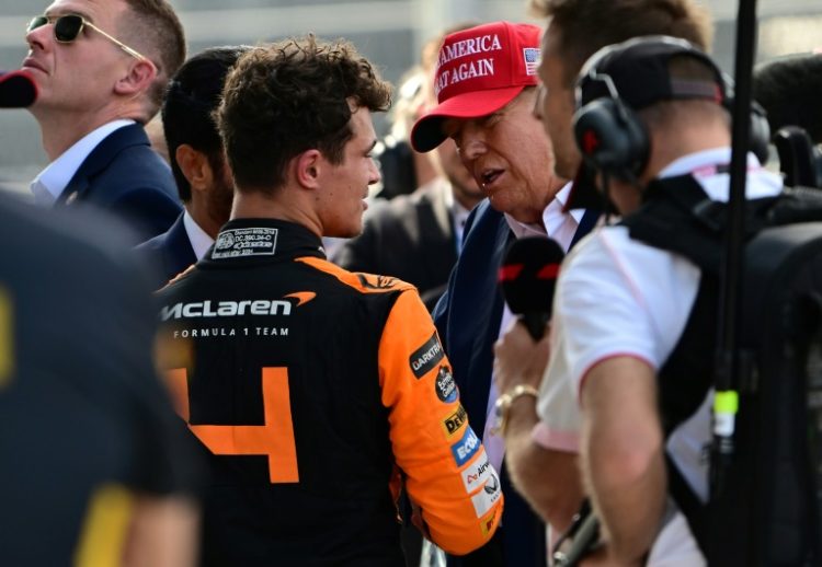 McLaren's British driver Lando Norris is congratulated by former US President and 2024 presidential candidate Donald Trump after winning the 2024 Miami Grand Prix.. ©AFP