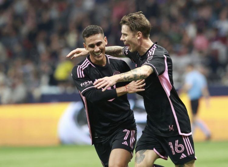 Robert Taylor celebrates with Inter Miami teammate Matias Rojas after opening the scoring in Saturday's 2-1 win at the Vancouver Whitecaps.. ©AFP