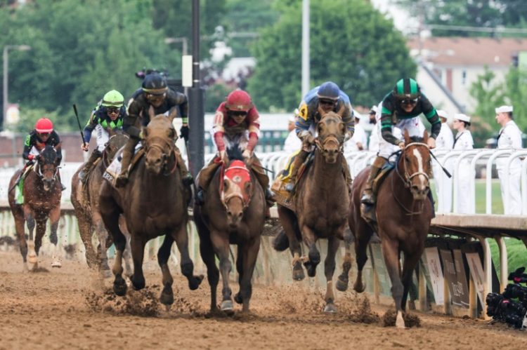 Mystik Dan, ridden by Brian Hernandez Jr., holds off Sierra Leone and Forever Young to win the 150th Kentucky Derby. ©AFP