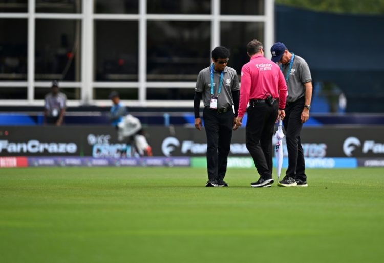 Match officials inspect the field before the T20 World Cup group A match between the USA and Ireland which was later abandoned. ©AFP