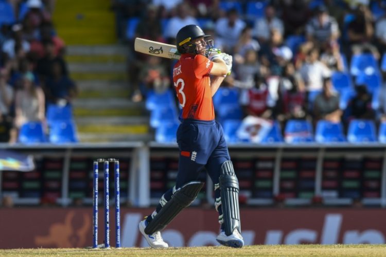 On the attack: England captain Jos Buttler hits a six during an eight-wicket rout of Oman in the T20 World Cup in Antigua. ©AFP