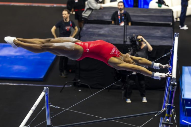 Simone Biles trains on the uneven bars ahead of the US Olympic gymnastics trials. ©AFP