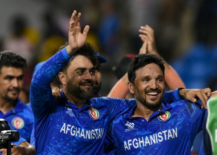 'Massive achievement': Afghanistan captain Rashid Khan (L) and Gulbadin Naib celebrate the win over Bangladesh. ©AFP