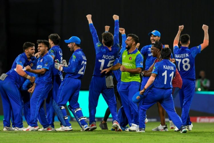 Afghanistan's players celebrate victory over Bangladesh at the T20 World Cup which sealed a place in the semi-finals and eliminated Australia. ©AFP