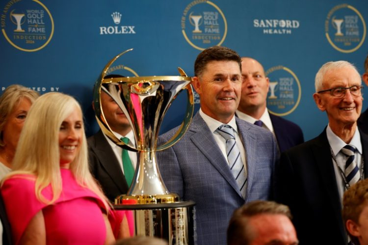 Ireland's Padraig Harrington, right-center, poses with family and friends prior to his induction in the World Golf Hall of Fame. ©AFP