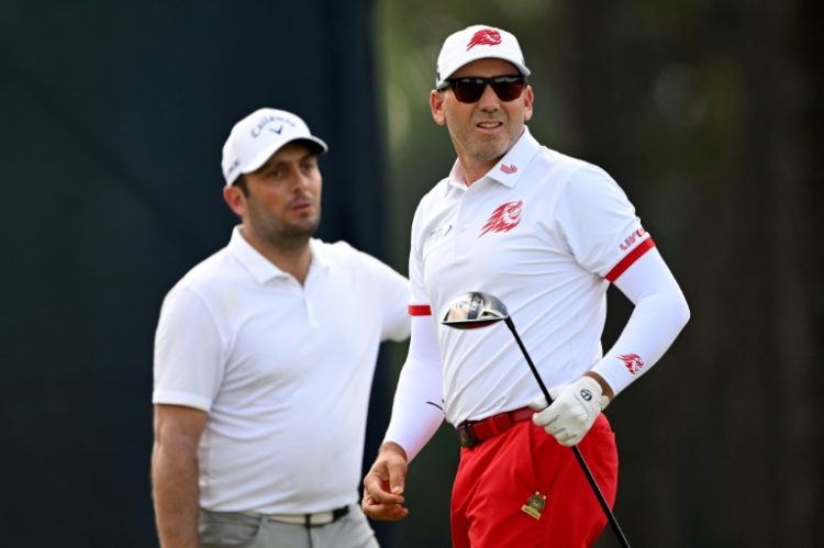Italy's Francesco Molinari, at left with Spain's Sergio Garcia, aced the par-3 ninth hole on Friday to make the cut on the number at the US Open. ©AFP