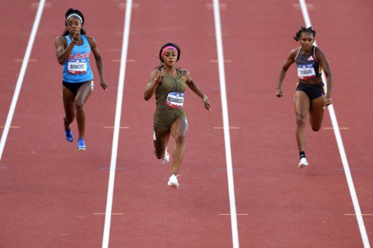 Sha'Carri Richardson (center) coasts to victory in the opening heat of the women's 100m at the US Olympic trials in Eugene, Oregon on Friday. ©AFP