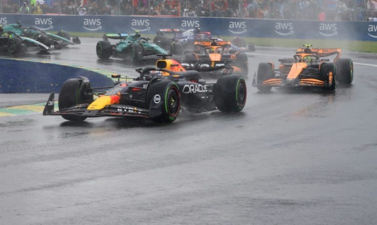 Max Verstappen leads Lando Norris as the spray flies at the Canadian  Grand Prix. ©AFP