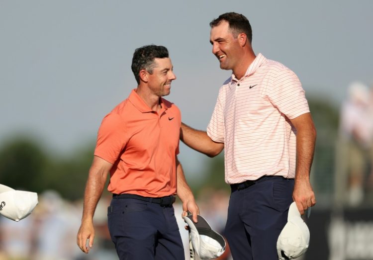 Rory McIlroy, left, speaks with top-ranked playing partner Scottie Scheffler after the first round of the US Open at Pinehurst, where Schefflr shot 71 and McIlroy shared the lead on 65. ©AFP