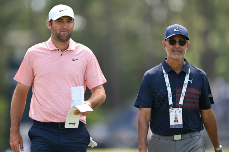 World number one Scottie Scheffler, left, walks with golf instructor Claude Harmon III on the fourth hole during a practice round ahead of Thursday's start of the 124th US Open at Pinehurst. ©AFP