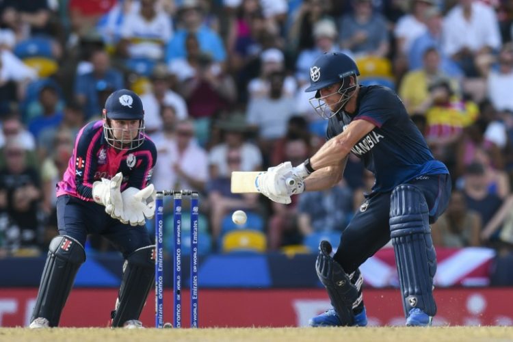 Gerhard Erasmus of Namibia hits a four after leading his team's recovery against Scotland in the T20 World Cup . ©AFP