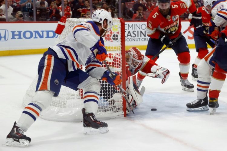 Florida goalie Sergei Bobrovsky makes a save against Connor McDavid in the Panthers' victory over the Edmonton Oilers in game one of the NHL Stanley Cup Final. ©AFP