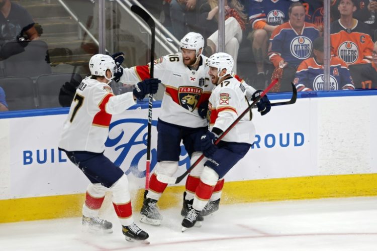 Florida's Aleksander Barkov celebrates with Niko Mikkola and Evan Rodrigues after scoring in the Panthers' victory over the Edmonton Oilers in game three of the Stanley Cup Final. ©AFP