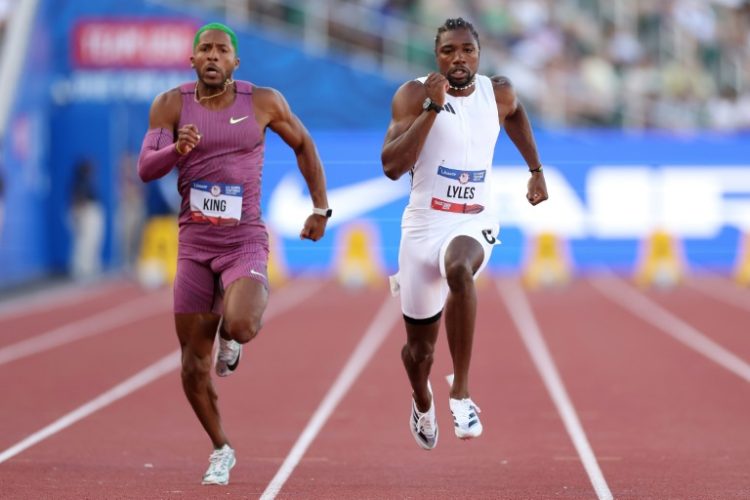 Reigning world champion Noah Lyles, right, won his preliminary heat over Kyree King, left, and other rivals at the US Olympic athletics trials to qualify for Sunday's semi-finals in Eugene, Oregon. ©AFP