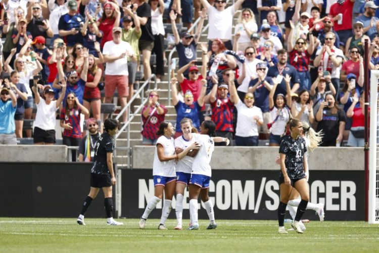 US defender Tierna Davidson is congratulated after scoring the first of her two goals in Saturday's friendly win over South Korea. ©AFP