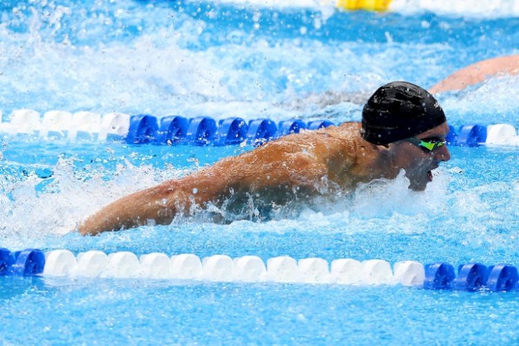 Caeleb Dressel is set to defend his 100m butterfly title at the Paris Olympics after a victory at the US Olympic swimming trials. ©AFP