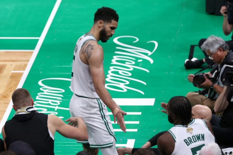Boston's  Jayson Tatum high fives teammate Jaylen Brown during the fourth quarter of the Celtics' victory over Dallas in game one of the NBA Finals. ©AFP