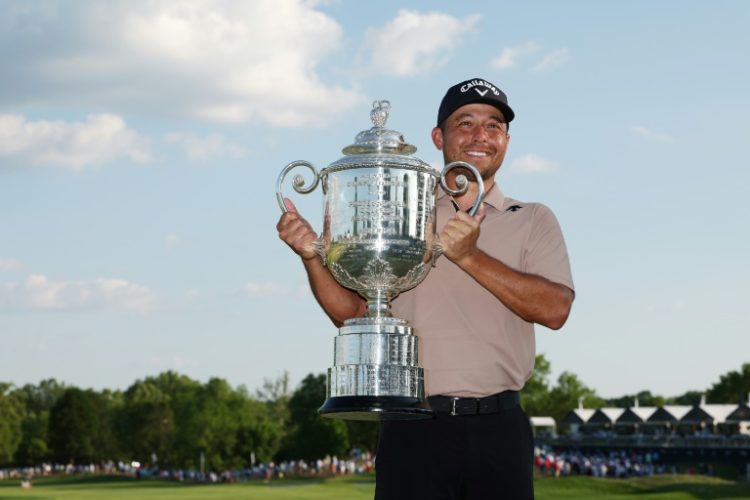 American Xander Schauffele, posing with the Wanamaker Trophy after winning his first major title at last month's PGA Championship, returns to competition at this week's PGA Memorial tournament. ©AFP