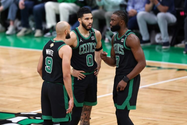 Boston's Derrick White, Jayson Tatum and Jaylen Brown huddle during the Celtics' win over Dallas in game two of the NBA Finals. ©AFP