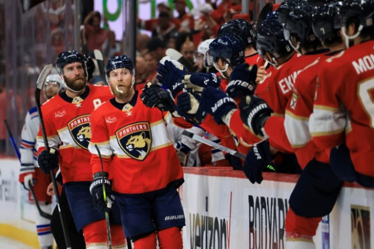 Florida's Sam Bennett, center, celebrates with teammates after scoring the first goal in a 2-1 Panthers victory over the New York Rangers that lifted his NHL club to the Stanley Cup Final. ©AFP