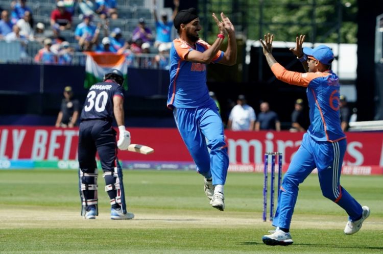 Flying start: India's Arshdeep Singh celebrates dismissing Shayan Jahangir off the first ball of the match. ©AFP