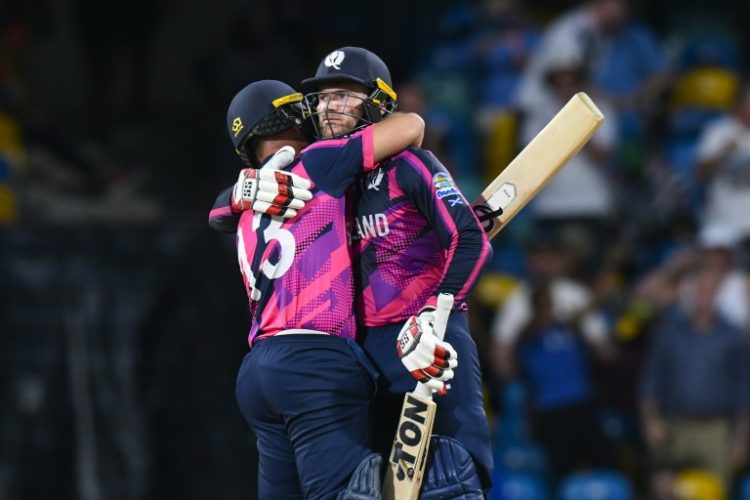 Scotland captain Richie Berrington (right) is congratulated by team-mate Chris Greaves after clinching victory over Namibia. ©AFP