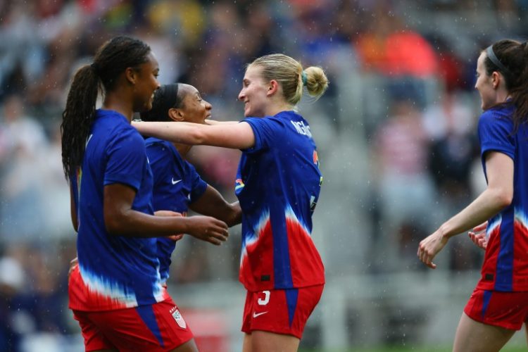 USA women's national team players celebrate after Crystal Dunn's opening goal in a 3-0 friendly win over South Korea . ©AFP