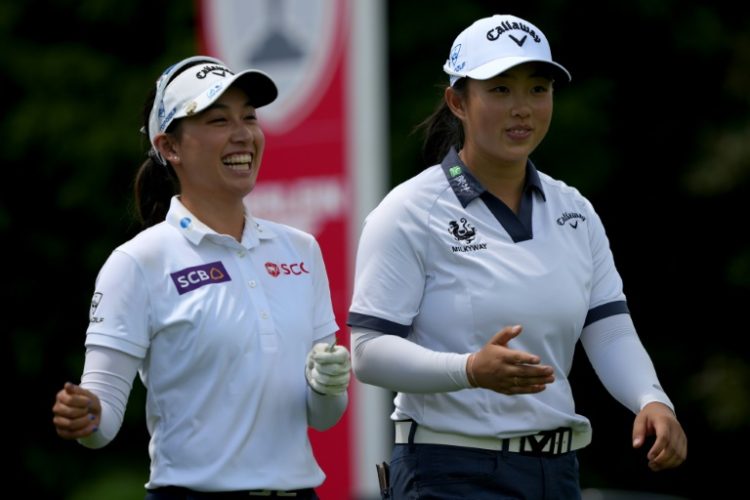 Thailand's Atthaya Thitikul, left, and China's Yin Ruoning, right, combined to shoot a six-under par 64 in alternate shot format to grab a share of the lead after the first round of the LPGA Great Lakes Bay Invitational. ©AFP