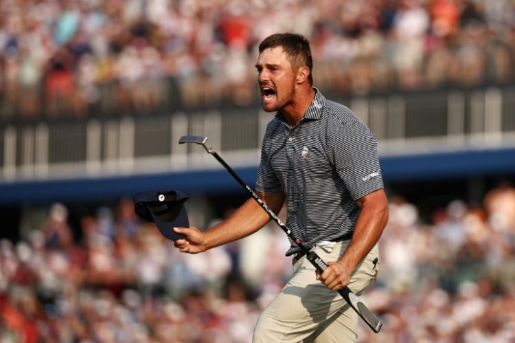 American Bryson DeChambeau reacts after sinking the winning putt at the 18th hole to capture the US Open at Pinehurst. ©AFP