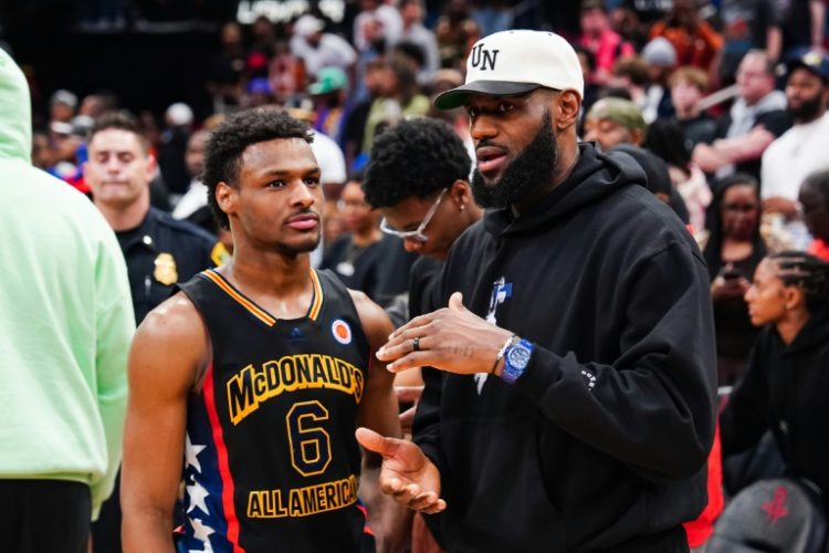 Bronny James, left, was selected by the Los Angeles Lakers with the 55th pick in the NBA Draft and could become the first NBA father-son combination playing for the Lakers alongside his superstar father, LeBron James, right. ©AFP