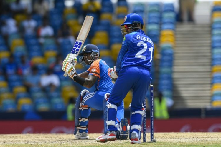 In the runs: India's Suryakumar Yadav hits a four as Afghanistan's Rahmanullah Gurbaz looks on . ©AFP
