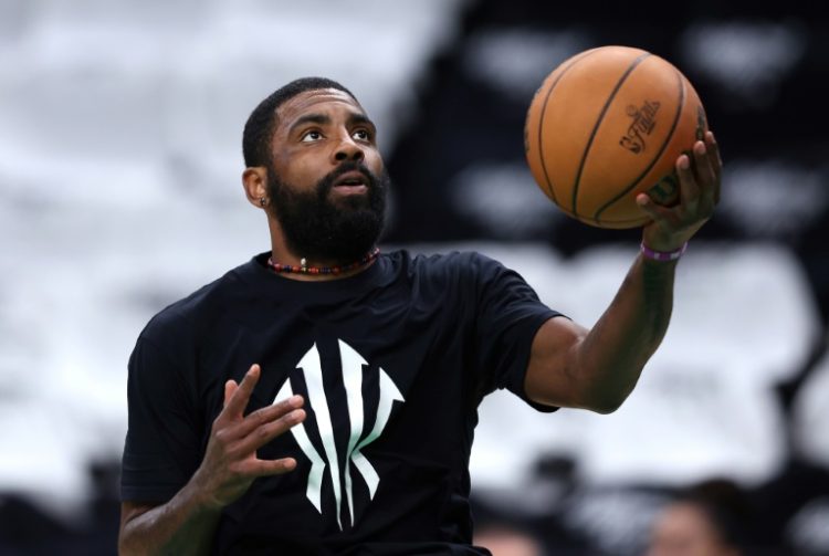 Dallas star Kyrie Irving warms up before game two of the NBA Finals against Boston. ©AFP