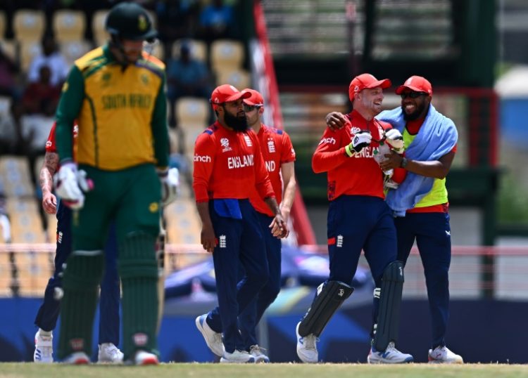 Key wicket: England celebrate after dismissing South Africa's Quinton de Kock for 65 in a T20 World Cup Super Eights match in St. Lucia. ©AFP