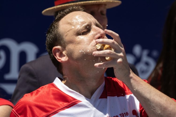 Joey Chestnut set a world record in winning the Nathan's Famous Fourth of July Hot Dog Eating Contest on Coney Island in New York in 2022 -- but this year, he is out of the competition. ©AFP