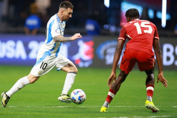 Argentina's Lionel Messi dribbles past Canada player Moise Bombito in Thursday's Copa America opener. ©AFP