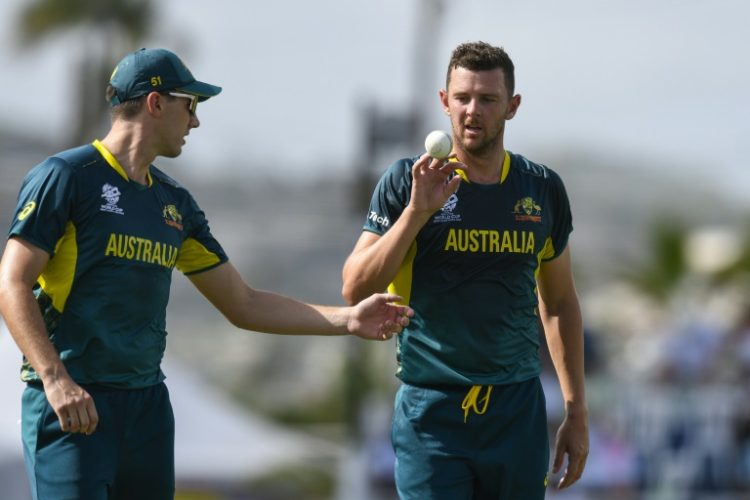 'Best interest' to see England exit: Australia's Josh Hazlewood (R) with Pat Cummins during their win over England in Barbados last week . ©AFP