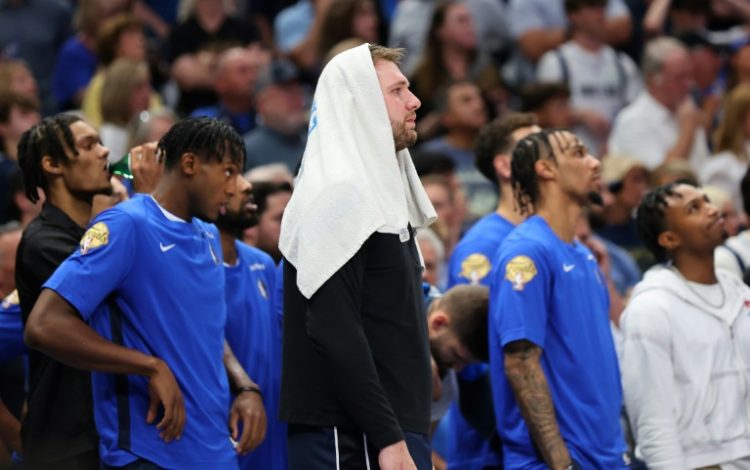 Dallas star Luka Doncic watches from the bench as the Mavs fall to the Boston Celtics in game three of the NBA Finals. ©AFP