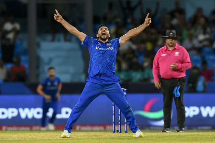 Afghanistan's Gulbadin Naib celebrates after the dismissal of  Australia's Glenn Maxwell during the T20 World Cup Super Eights match on Saturday.. ©AFP