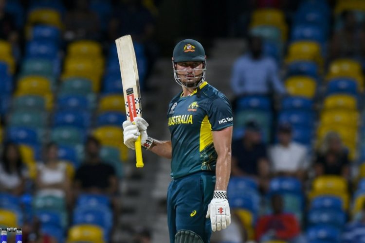 Australia's Marcus Stoinis marks his half-century in a swashbuckling 66 not out against Oman at the T20 World Cup. ©AFP