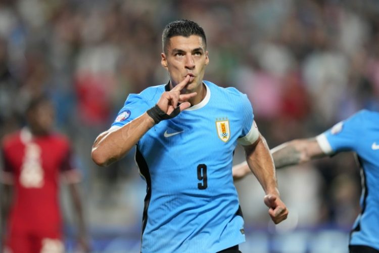 Uruguay's Luis Suarez celebrates his injury-time equaliser in the Copa America third place playoff win over Canada. ©AFP