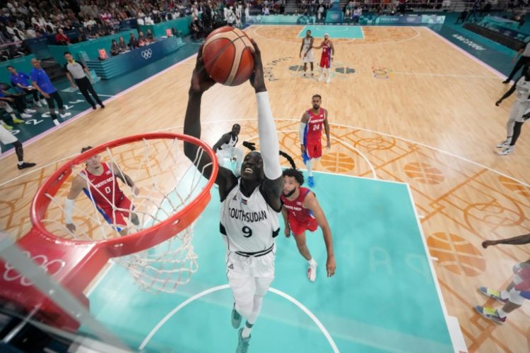 On the rise - Wenyen Gabriel dunks for South Sudan aganst Puerto Rico. ©AFP