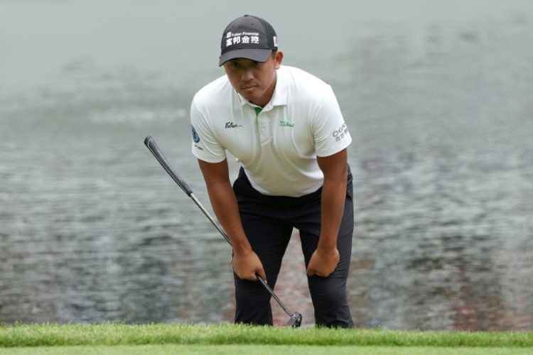 C.T. Pan of Taiwan lines up a putt n the way to a share of the halfway lead at the US PGA Tour John Deere Classic. ©AFP