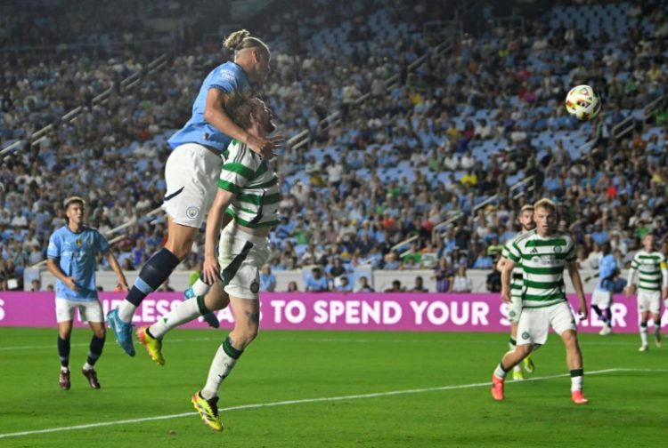 Manchester City's Norwegian striker Erling Haaland, top, heads the ball into the goal in the 57th minute during his team's 4-3 loss to Celtic in a pre-season tuneup friendly in Chapel Hill, North Carolina. ©AFP