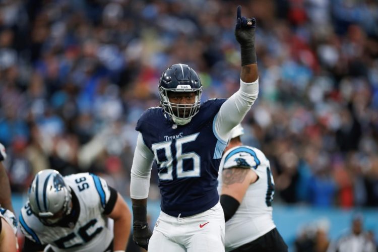 Defensive end Denico Autry of the Houston Texans, shown celebrating a quarterback sack last season while playing for Tennessee, was suspended for six games by the NFL after testing positive for performance-enhancing drugs. ©AFP