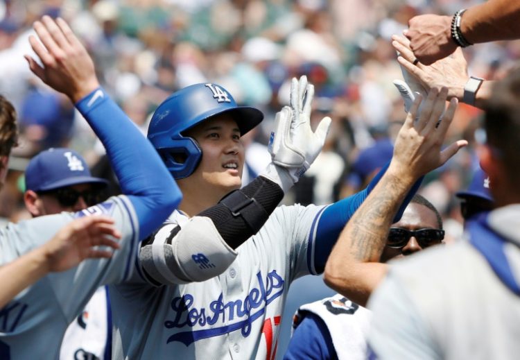 Los Angeles Dodgers' star Shohei Ohtani celebrates his 200th Major League Baseball home run, in game against the Detroit Tigers. ©AFP