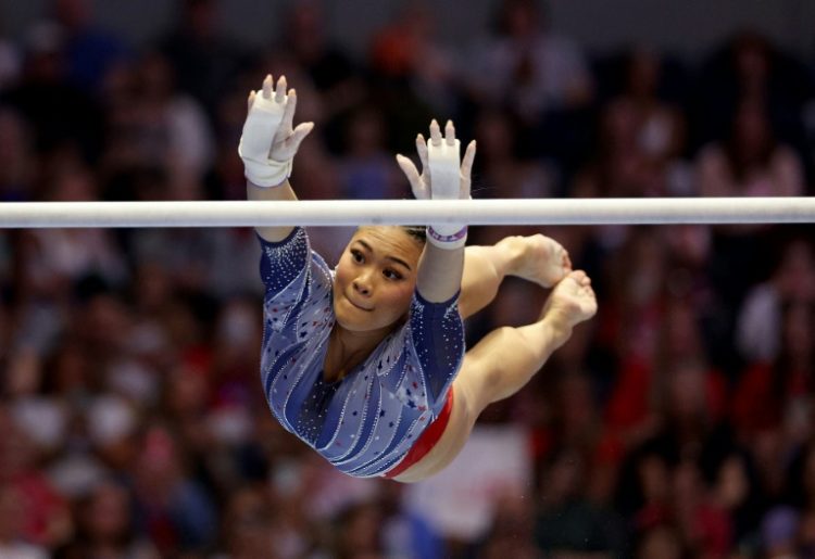 Reaching for gold: Suni Lee is returning to defend her Olympic crown after a career-threatening illness. ©AFP